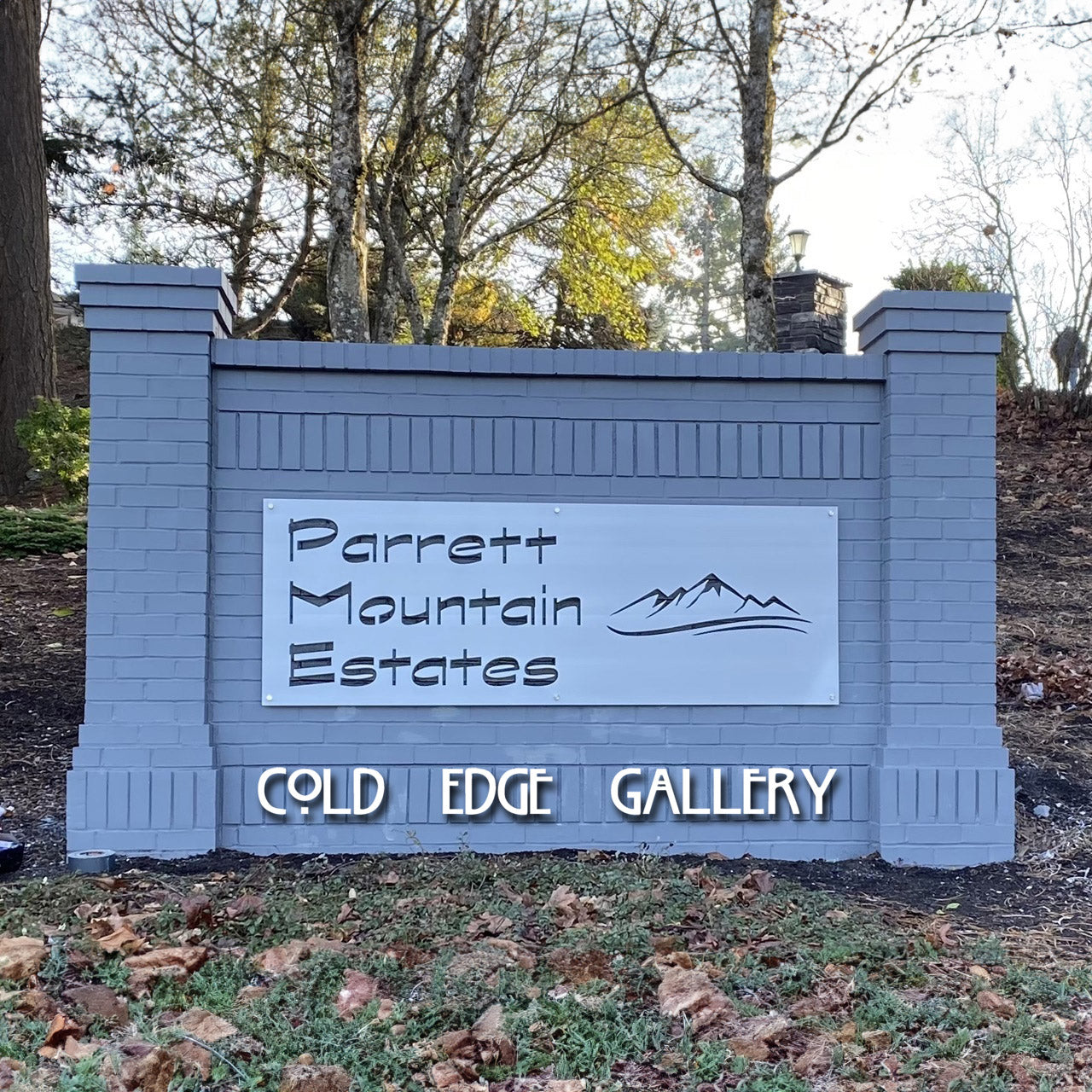 Decorative metal artwork sign serving as a room divider at Parrett Mountain Estates.