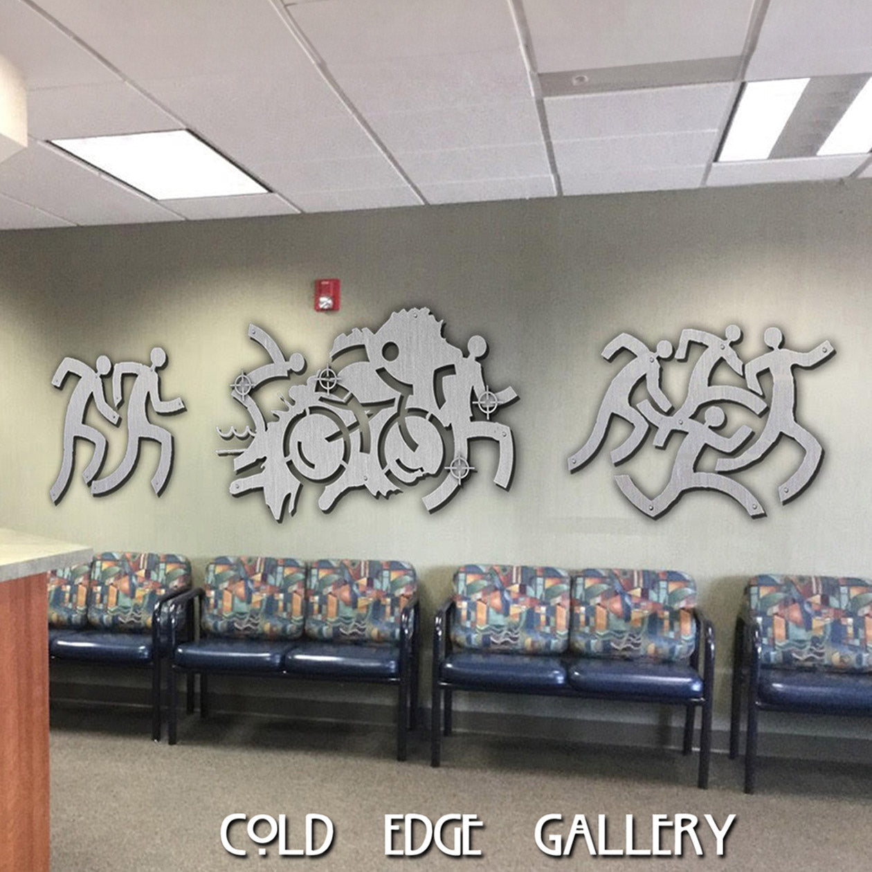 Abstract metal artwork resembling room dividers on an office wall.