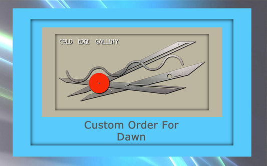 Image of a framed artwork titled "Custom Order For Dawn" from Cold Edge Gallery, featuring two large metal scissors and a red dot against a beige background.