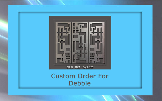 A metal artwork is displayed within a blue frame. The text "Custom Order For Debbie" is written underneath the artwork. The bottom of the artwork says "Cold Edge Gallery.