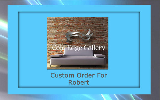 A light gray couch placed against a brick wall with a metallic abstract artwork piece above it. "Cold Edge Gallery" text overlay. Below the image, the text reads "Custom Order For Robert.