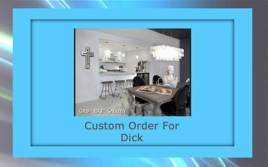 A modern living space with a kitchen in the background features a dining table adorned with a bust sculpture, framed photo, and sleek metal accents. The text reads, "Cold Edge Gallery - Custom Order For Dick.