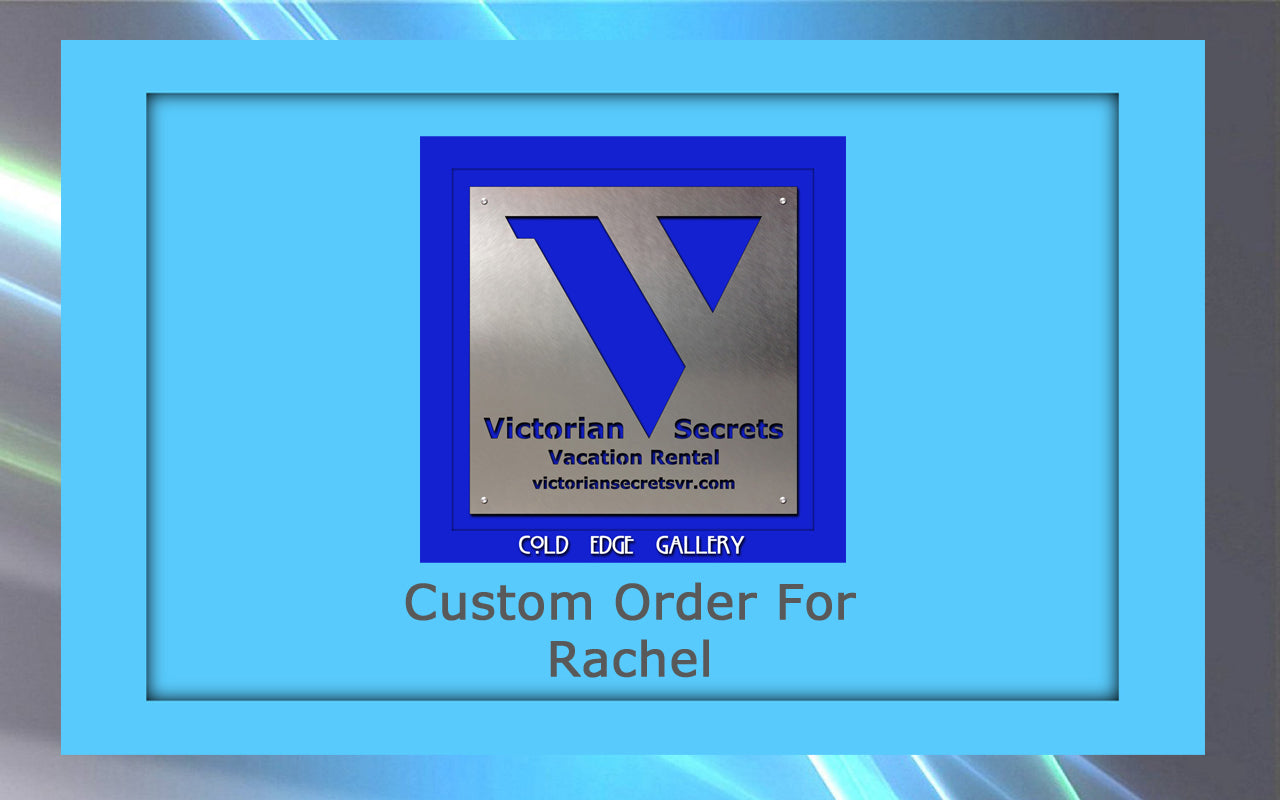 A sign for Victorian Secrets Vacation Rental features a metallic 'V' logo. The custom artwork includes text that reads "Custom Order For Rachel" and the website victoriansecretstv.com. At the bottom, it says "Cold Edge Gallery.