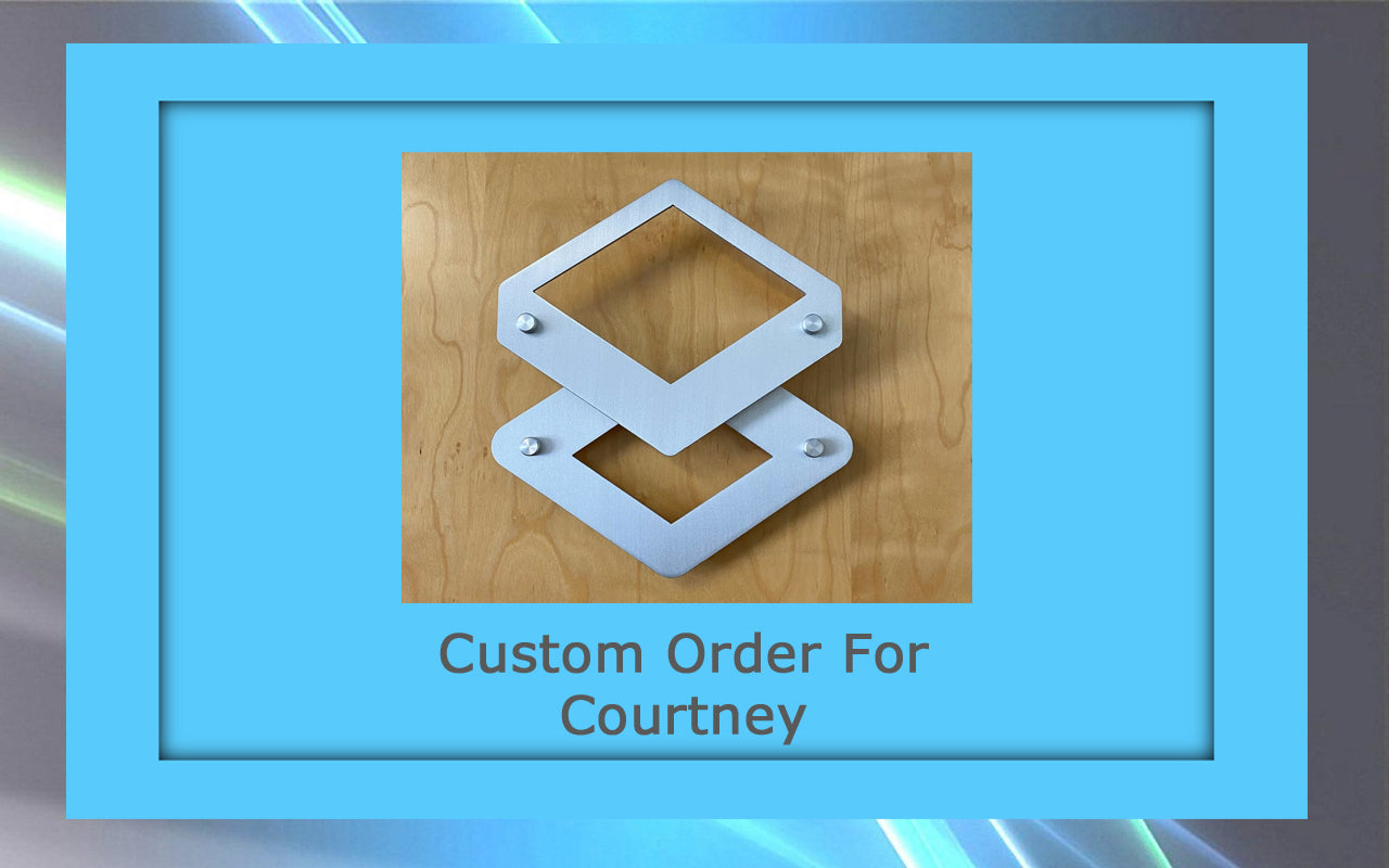 A custom artwork featuring geometric metal shapes on a wooden surface, framed in blue with the text "Custom Order For Courtney.