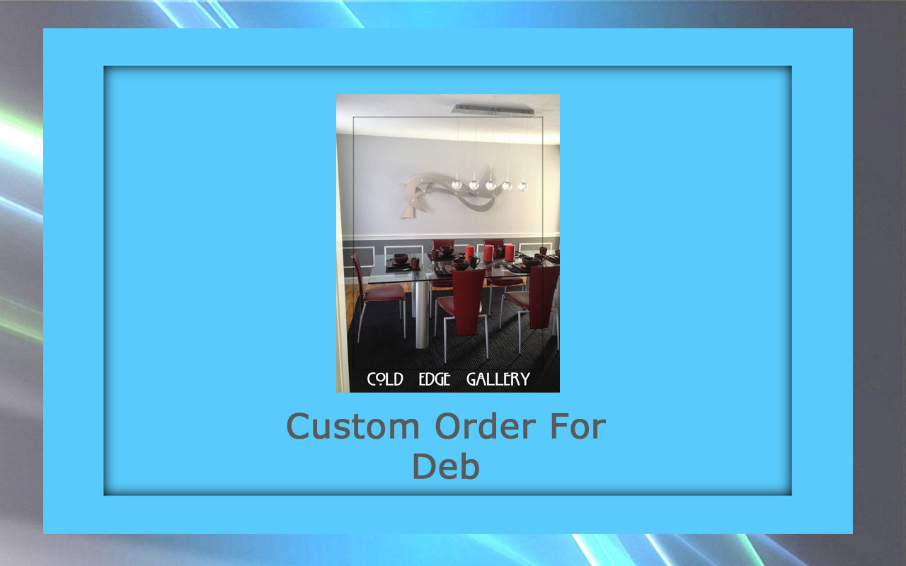 A framed picture featuring a dining room setup with red chairs, a wooden fish wall decoration, and custom artwork labeled "Custom Order For Deb" in a "Cold Edge Gallery" frame.