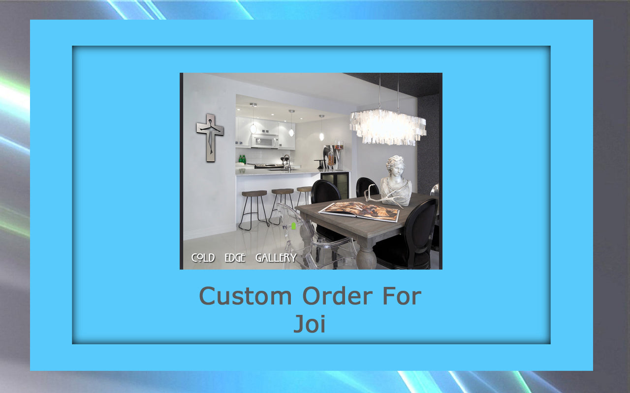 Interior of a modern kitchen and dining area featuring custom artwork, a metal sculpture, and a chandelier. A cross adorns the wall. Text reads "Custom Order For Joi" and "Cold Edge Gallery.