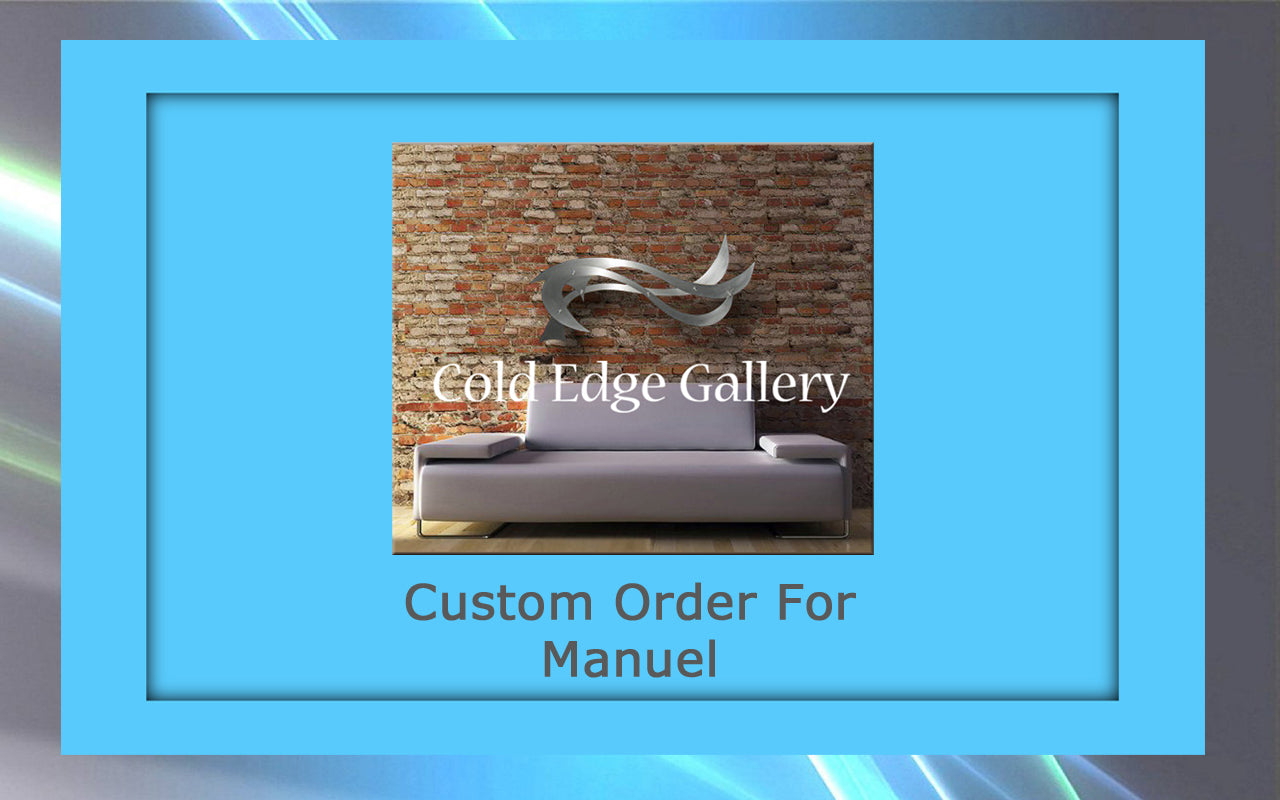 A custom couch in front of a brick wall accentuated by sleek metal artwork.