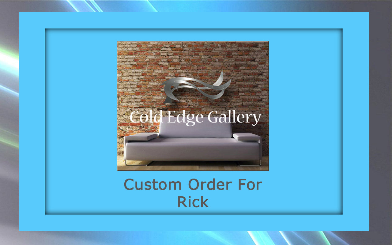 Image of a modern metallic fish sculpture mounted on a brick wall above a gray sofa. Text reads "Cold Edge Gallery" and "Custom Artwork For Rick." The image is framed with a blue border.