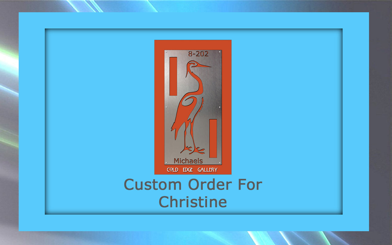 A custom metal sign featuring a red crane design with the text "8-202," "Michaels," and "Gold Eagle Gallery." The artwork is bordered in blue with the words "Custom Order For Christine.