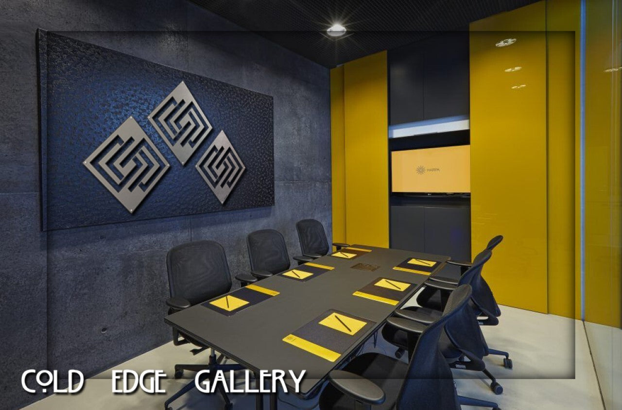 A modern conference room with a large table, yellow chairs, custom geometric wall art, and the text "Cold Edge Gallery" at the bottom left corner.