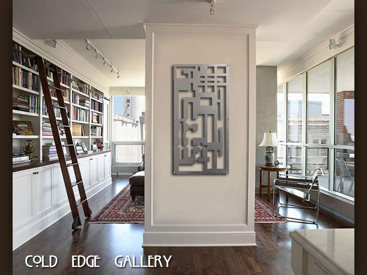 A modern art piece hangs on a white divider wall in a contemporary living area with a bookshelf on the left, a ladder, and a large window on the right. Text reads "COLD EDGE GALLERY" at the bottom.