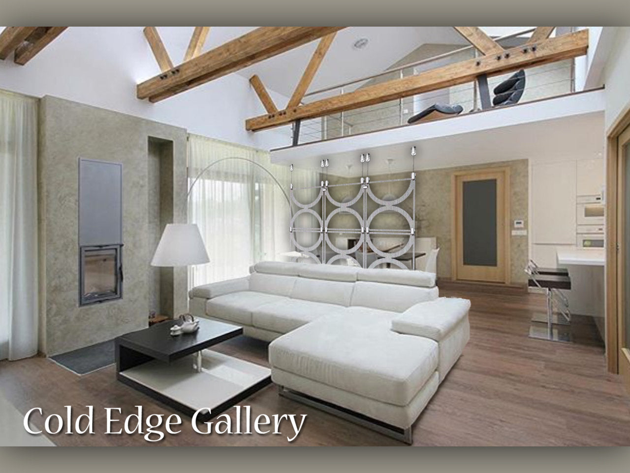 A modern living room with a white sectional sofa, wooden floors, exposed beams, and a minimalist style. The background features a loft area and a kitchen. Text reads: "Cold Edge Gallery.