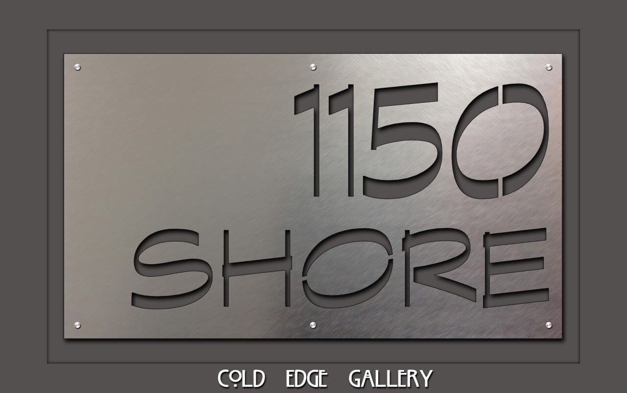 A metal sign with the text "1150 Shore" cut out, displayed above the phrase "Cold Edge Gallery.